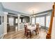 Bright dining area featuring a traditional table and chairs, wood floors, and a welcoming open layout at 5794 S Yakima Way, Aurora, CO 80015