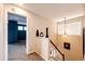 Hallway with view of the bedroom and a decorative pendant light at 5794 S Yakima Way, Aurora, CO 80015