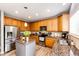 Well-lit kitchen featuring stainless steel appliances and granite countertops at 5794 S Yakima Way, Aurora, CO 80015