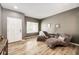 Comfortable living room with neutral walls, wood floors, and cozy seating; a bright and inviting space at 5794 S Yakima Way, Aurora, CO 80015