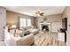 Inviting living room with a cozy fireplace and comfortable seating at 5794 S Yakima Way, Aurora, CO 80015