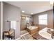 A main bathroom featuring double sinks, a walk-in shower, and a soaking tub at 5794 S Yakima Way, Aurora, CO 80015