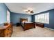Bright main bedroom featuring neutral carpet and large window at 5794 S Yakima Way, Aurora, CO 80015