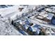 Aerial view of townhouses in snowy community at 22991 E Roxbury Dr # B, Aurora, CO 80016