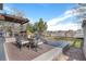 This back deck features an outdoor seating area and a beautiful view of the lawn and fence in the backyard at 23841 E Alabama Dr, Aurora, CO 80018