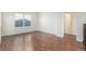 Bedroom features hardwood floors, a window, and an ensuite bathroom at 23841 E Alabama Dr, Aurora, CO 80018