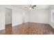 Spacious bedroom with a ceiling fan, hardwood floors, and walk-in closet at 23841 E Alabama Dr, Aurora, CO 80018