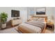 Tastefully decorated bedroom with modern furniture, neutral colors, and ample natural light at 23841 E Alabama Dr, Aurora, CO 80018