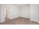 Bedroom with hardwood floors and an attached bathroom with glass enclosed shower at 23841 E Alabama Dr, Aurora, CO 80018