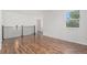 Upstairs landing area with hardwood floors and a view of the staircase at 23841 E Alabama Dr, Aurora, CO 80018