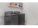 Laundry area featuring front-load washer and dryer set with white walls at 23841 E Alabama Dr, Aurora, CO 80018