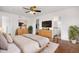 Main bedroom features hardwood floors, a ceiling fan, ensuite bathroom, and walk-in closet at 23841 E Alabama Dr, Aurora, CO 80018