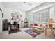 A bedroom with bright light and window seating, perfect for relaxation and creative pursuits at 23545 E Phillips Pl, Aurora, CO 80016