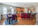 Eat-in kitchen with stainless steel appliances, hardwood floors, and ample counter space at 23545 E Phillips Pl, Aurora, CO 80016
