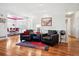 Bright and open living room featuring hardwood floors and stylish furniture at 23545 E Phillips Pl, Aurora, CO 80016