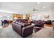 Bright open-concept living space flows into a modern kitchen and dining area at 23545 E Phillips Pl, Aurora, CO 80016