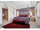 Relaxing main bedroom featuring a four-poster bed, ceiling fan, and ample natural light at 23545 E Phillips Pl, Aurora, CO 80016