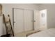 Bedroom with sliding door closet and additional door leading to hallway at 27655 E Geddes Pl, Aurora, CO 80016