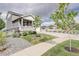 Charming two-story home features a welcoming porch and well-manicured lawn at 27655 E Geddes Pl, Aurora, CO 80016
