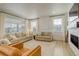 Spacious living room with neutral tones, large windows, and ample natural light create a cozy atmosphere at 27655 E Geddes Pl, Aurora, CO 80016