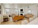 Inviting living room with a fireplace, comfortable seating, and a view of the entertainment center at 27655 E Geddes Pl, Aurora, CO 80016