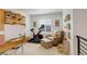 Bright office with a peloton bike, open shelving, and natural light at 27655 E Geddes Pl, Aurora, CO 80016
