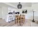 Bright dining area with pendant lighting and views into the adjacent kitchen space at 11981 E Yale Ave, Aurora, CO 80014