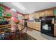 Kitchen and dining area featuring modern appliances and decorative accents at 7573 Woodruff St, Fort Lupton, CO 80621