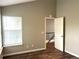 Bright bedroom with wood floors and a window letting in natural light at 1470 S Quebec Way # 275, Denver, CO 80231