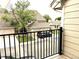 View from the balcony highlighting a row of townhomes and a parked car at 1470 S Quebec Way # 275, Denver, CO 80231