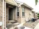 Charming brick home with a welcoming front entrance featuring a storm door for added security at 1470 S Quebec Way # 275, Denver, CO 80231
