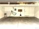 Empty garage with visible storage and a clean cement floor at 1470 S Quebec Way # 275, Denver, CO 80231