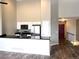 Bright modern living room area with a clear view of the staircase and entryway at 1470 S Quebec Way # 275, Denver, CO 80231