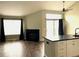 Spacious living room has a fireplace, lots of light from the large window, and access to the patio at 1470 S Quebec Way # 275, Denver, CO 80231