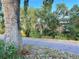 View of a tree-lined street with houses in the background at 1470 S Quebec Way # 275, Denver, CO 80231