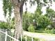 View of a street featuring large trees and partial view of houses at 1470 S Quebec Way # 275, Denver, CO 80231