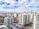 A high-rise condominium complex with a scenic backdrop of mountains and a city skyline at 777 N Washington St # 204, Denver, CO 80203