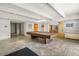 Community game room with pool table and additional lounge areas at 777 N Washington St # 204, Denver, CO 80203