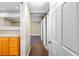 Hallway with multiple sliding doors and access to bathroom at 777 N Washington St # 204, Denver, CO 80203