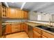 Well-lit kitchen with wooden cabinets, stainless steel appliances, and ample counter space at 777 N Washington St # 204, Denver, CO 80203