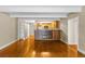 The open-concept space is a combined living room and kitchen area with hardwood floors at 777 N Washington St # 204, Denver, CO 80203