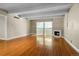 A bright living room features hardwood floors, a fireplace, and a sliding glass door to a balcony at 777 N Washington St # 204, Denver, CO 80203