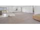 Spacious basement featuring neutral carpet, and a walkout to the back yard at 2400 Ventress Ct, Bennett, CO 80102