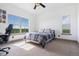 Cozy bedroom offering natural light, a comfortable desk, and a pleasant view enhancing the room's atmosphere at 2400 Ventress Ct, Bennett, CO 80102