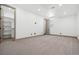 Bedroom features neutral carpet, light colored walls and a closet at 2400 Ventress Ct, Bennett, CO 80102