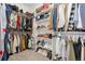 Organized walk-in closet featuring ample storage with racks, shelves and space for shoes and clothing at 2400 Ventress Ct, Bennett, CO 80102