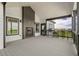 An inviting deck with a fireplace and seating, perfect for enjoying the scenic views at 2400 Ventress Ct, Bennett, CO 80102