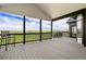 An expansive covered deck featuring a railing and panoramic views of the surrounding landscape at 2400 Ventress Ct, Bennett, CO 80102