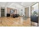 Elegant dining room with a modern chandelier, stylish decor, and hardwood floors at 2400 Ventress Ct, Bennett, CO 80102