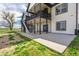 A view of the exterior of the home featuring a walkout basement and elevated deck at 2400 Ventress Ct, Bennett, CO 80102